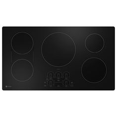 a black stove top with four burners