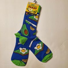 Avocado Toast Socks! Enjoy the Fun Iconic Healthy Breakfast on this Novelty Sock from Locals Only!  Size: Unisex, One Size - Although Sold in Men's Category/Departments Length: Mid Calf Colors: Sock is Royal Blue with Lime Green Heel and Toe Graphics: Avocado Toast with Fried Egg, Lemon Slice, Half of an Avocado with Pit, and a Knife for Spreading FUN Novelty Gift  NEW Shipped FREE from Smoke Free Environment in USA Fun Blue Cotton Socks, Avocado Toast With Egg, Lime Green Heels, Toast With Egg, Locals Only, Avocado Toast Egg, Green Heels, Lemon Slice, Novelty Socks