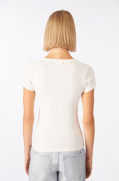 The tee, perfected. All the details are taken care of, from the curve of the neckline and the soft 1x1 rib, to the short sleeves that fall in the right spot. But our favorite has to be the throwback shoulder seam. COLOR: EGGSHELL FIT & MEASUREMENTS: Length = 23 3/4" Chest = 13 1/2" Measurements taken from size Small Anaiis is wearing size S and is 5'11" FABRIC & CARE: 100% Cotton Machine Wash Cold. Made with love in Los Angeles Fitted Short Sleeve Top With Ribbed Neckline, Casual Fitted Short Sleeve Top With Ribbed Neckline, Fitted Cap Sleeve T-shirt For Spring, Fitted Scoop Neck T-shirt With Ribbed Neckline, Penny Tees, Egg Shells, Cotton Poplin, The Details, Fabric Care