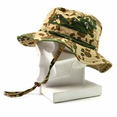 Original German army tropical camouflage boonie hat Hat feature screened grommet holes for comfortable ventilation and an adjustable chin strap Press-stud button at one side so brim can be fastened up. Outer material: 80% cotton / 20% polyester Brim: 65% Viscose / 35% Polyester Condition: Used Please take a note: Exact size might be different than you'll see originally labeled Due to washing, caps have been shrunk, we manually remeasuring each cap to ensure the correct size STANDARD SHIPPING Ord Military Style Khaki Bucket Hat, Adjustable Camouflage Military Hat, Adjustable Military Hunting Hat, Adjustable Military Camouflage Hat, Khaki Military Hat For Hunting, Military Style Khaki Hunting Hat, Khaki Military Style Hunting Hats, Adjustable Military Bucket Hat For Camping, Military Camouflage Bucket Hat