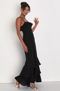 With a fabulous look like the Lulus Lively Evenings Black Sleeveless Tiered Maxi Dress, you're sure to bring an enticing energy to any special occasion! Airy woven chiffon shapes this inspiring dress that features a bustier-style bodice with seamed cups, a straight neckline adorned with flouncy ruffled trim, and adjustable spaghetti straps. The high, fitted waist tops a figure-skimming, A-line skirt that falls to a trendy tiered maxi hem. Hidden back zipper/clasp. Fit: This garment fits true to size. Length: Floor length. Size medium measures 52" from adjustable straps to hem. Bust: Great for any cup size. Waist: Fitted - very fitted at natural waist. Hip: Loosely Fitted. Undergarments: May be worn with a strapless bra, adhesive bra, petals, or no bra. Fabric: Fabric has no stretch. Lined. Pre-draped Sleeveless Dress With Ruffles, Pre-draped Sleeveless Evening Dress With Ruffles, Flowy Pre-draped Party Dress, Fitted Sleeveless Chiffon Dress With Ruffles, Elegant Maxi Dress With Ruffled Straps For Cocktail, Pre-draped Spaghetti Strap Formal Dress, Sleeveless Chiffon Party Dress With Ruffles, Formal Maxi Dress With Ruffled Straps For Summer, Formal Summer Maxi Dress With Ruffled Straps