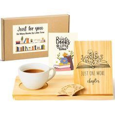 a cup of coffee next to a wooden coaster and book with just for you written on it