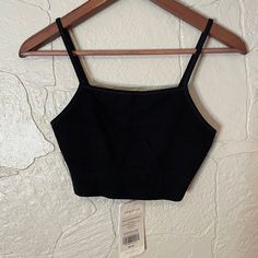 New! Never Worn Band Measures Approximately 11.5" When Laying Flat Soft Ribbed Fabric For Ultimate Comfort All-Way Stretch Moisture-Wicking Low-Impact Smoke Free Home No Trades Black Stretch Bra-friendly Crop Top, Black Seamless Crop Top For Workout, Black Seamless Construction Crop Top For Workout, Black Crop Top With Built-in Bra And Medium Support, Black Crop Top With Medium Bust Support For Yoga, Black Seamless Tank Top With Built-in Bra, Black Seamless Crop Top For Gym, Black Crop Top Activewear With Built-in Bra, Black Cropped Sports Bra With Seamless Construction