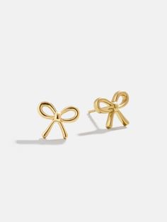 Tie off your ear stack with a bow. The 18k Gold Bow Stud Earrings are dainty and delicate bow earrings, crafted with 18k gold plated sterling silver for years of styling. Pair with other gold jewelry or let them shine on their own — they're perfect everyday essentials either way. Earrings Gold Stack, Gold Stud Earring, Jelewry Gold, Cute Earrings Studs, Bday Gift Ideas, Gold Dainty Jewelry, Earring Stacks, Jewelry Bow, Christmas Lists