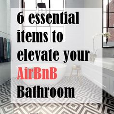 a bathroom with black and white flooring and a bathtub in the middle of it