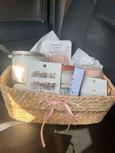 a basket filled with items sitting on top of a car seat