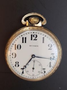 The Buren Watch Company was created in 1898, following the acquisition of Fritz Suter & Cie, at the Swiss town Büren ander Aare (canton Bern), by the London company of H. Williamson Ltd. There were produced pocket watches of all types and table clocks. In 1966 the Buren Watch Company was sold to the Hamilton Watch Company. Buren quickly became the manufacturer of the majority of Hamilton watches, eliminating US production. Production year: 1935/12 Dial diameter of 42mm 7 Jewels Size: 14s (I believe) Case Style: Open face Case plate: 10k Rolled Yellow Gold Plate Last Serviced: 02/09/2023 Runs like a charm! Vintage Yellow Gold Pocket Watch With Polished Finish, Vintage Yellow Gold Pocket Watch With Subdials, Heirloom Chronometer Watch For Formal Occasions, Formal Heirloom Chronometer Watch, Vintage Pocket Watch For Anniversary With Polished Finish, Vintage Pocket Watch For Anniversary, Antique Collectible Watches With Polished Finish, Antique Collectible Watch With Polished Finish, Antique Chronometer Watch For Anniversary