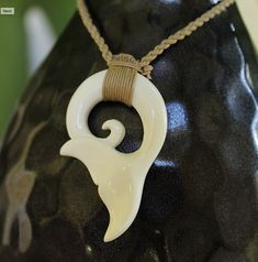 Beautifully handcrafted Buffalo bone handcrafted pendant on woven adjustable jute neck cord. Polished and detailed to bring out the best in each design. Set includes one of each Fish hook, Whale Tail and Petroglyph Honu! Individually boxed to give as gifts. Great quality and style at an affordable low price! Our buffalo bone pendants are great in and out of the water so you never have to take them off. Braided cording is adjustable so it fits from keiki to adults. Great for men and women, boys a Adjustable Fair Trade Jewelry For Gifts, Artisan Jewelry With Adjustable Length As Gift, Artisan Jewelry With Adjustable Length For Gift, White Bohemian Jewelry With Waxed Cord, Bohemian White Waxed Cord Jewelry, White Waxed Cord Beach Jewelry, Unique Waxed Cord Necklace As Gift, White Waxed Cord Jewelry For Beach, White Waxed Cord Jewelry For The Beach