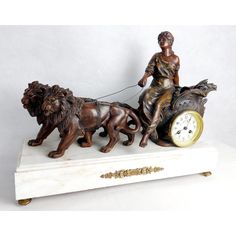 a statue of a woman riding on a horse pulling a dog with a clock in front of her