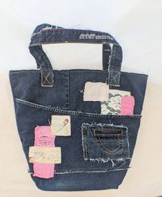 "These designer Market Bags is perfect if you love dark denim. Constructed from upcycled dark denim and lovely french themed fabric. With pink denim patches and little peeks of lace. It has been reinforced in all the right places. Perfectly distressed with pockets, holes, patches and leather labels. It's perfect for holding everything you need. With pockets inside and out to help keep you organized. Fresh cotton canvas lines the inside of the bag. With pockets and patches to make sure the inside Upcycled Cotton Bag, Upcycled Dark Wash Cotton Bag, Vintage Upcycled Denim Bag, Denim Table Runner, Shabby Chic Bags, Jeans Wedding, Recycled Jeans Bag, Jean Bag, Denim Wedding