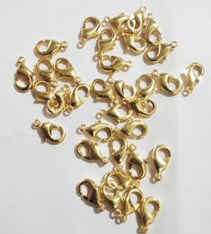 gold plated metal clasps on white background