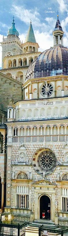 an ornate building with many windows and domes