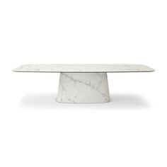 a white marble table with an oval shaped top and pedestal base, on a white background