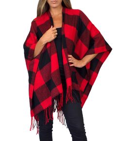 "This cozy chic knit poncho features a bold plaid print with fringe trim, and lightweight, flowing material that is comfortable and warm. Wear with your favorite boots for a stylish, yet casual look on chilly days. Material: 100% Acrylic Sizing: One size fits all Garment Measurements: 46\" x 55\" Model Measurements: Bust: 32\" Waist: 26\" Hips: 36\" Height: 5'5 We are taking steps towards sustainability! Your order will be packaged in tissue paper made from recycled materials and a biodegradable Winter Plaid Poncho, Plaid Winter Poncho, Oversized Plaid Poncho For Fall, Oversized Red Cape For Fall, Sweater Blanket, Knit Plaid, Cut Leggings, Black And White Flannel, Waffle Sweater