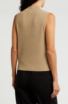 Knit from soft yarns, a lightweight, refined mock-neck sweater is a luxe layering option when the temperature starts to drop. Mock neck Sleeveless 92% polyester, 8% metallic fibers Machine wash, dry flat Imported High Neck Textured Knit Top For Layering, Textured Knit High Neck Top For Layering, Spring Workwear Textured Knit Sweater Vest, Chic Textured Knit Beige Sweater Vest, Stretch Textured Knit Sweater Vest For Layering, Beige Textured Knit Sweater Vest For Layering, Chic Beige Textured Knit Sweater Vest, Fine Knit Sweater Vest For Spring Layering, Fine Knit Sweater Vest For Spring