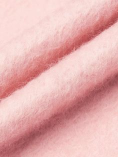 a close up view of pink wool fabric with very soft, fuzzy textured material