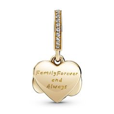 Take your love to new heights with the Sparkling Infinity Heart Dangle Charm. The front dangle is hand-finished in 14k gold and features an infinity symbol wrapped around a sparkling heart set with clear cubic zirconia. The back dangle is decorated with hand-applied shimmering silver enamel to provide the perfect backdrop and includes the love-filled engraving “Family forever and always." Gift this detailed charm to your loved one as a reminder of your close bond. Elegant Pendant Charms For Mother's Day, Elegant Mother's Day Pendant Charms, Dangling Charms Jewelry For Valentine's Anniversary, Valentine's Day Anniversary Jewelry With Dangling Charms, Anniversary White Gold Jewelry With Dangling Charms, Anniversary Jewelry With Removable Heart Charms, Elegant 14k Gold Heart Charm, Elegant Heart Pendant Jewelry With Removable Charms, Elegant Dangling Charms For Mother's Day