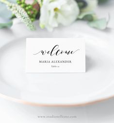 a place card sitting on top of a white plate