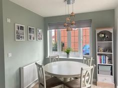 a white table and chairs in a room