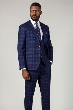 A blue and tan combination cannot be underestimated, and this Chigwell suit is no exception. Featuring a timeless woven check in varying shades of blue and contrast tan buttons, it makes for the perfect choice for your next formal event. Cut to a slim fit, it defines the body to create a flattering silhouette and with a complimentary pocket square you'll always look presentable. A versatile suit for every occasion. Model wears size 38R blazer, 38R waistcoat & 32R trousers. Features Slim fit Sing Blue Tweed Suits For Work, Blue Tweed Suit For Work, Blue Tweed Suits With Notch Lapel, Blue Tweed Suit With Notch Lapel, Fitted Blue Tweed Suits, Classic Blue Tweed Suit, Elegant Blue Tweed Suit, Blue Tweed Suits, Tan Brogues