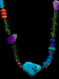 Add color and charm to your look with this stunning turquoise, amethyst, silver, and glass bead necklace. This handmade piece is one-of-a-kind and features a beautiful heart-shaped turquoise pendant that symbolizes protection and love. The purple amethyst beads bring abundance and harmony to your life. This necklace is 27 inches long and has a silver clasp. It is a perfect accessory for any occasion, whether you want to dress up a casual outfit or add some sparkle to a formal one. You will love how this necklace makes you feel confident and radiant. One of a kind, order yours today and enjoy this unique and artisanal creation. Boho Chic Necklace, Pure Joy, Amethyst Beads, Multi Strand Necklace, Beautiful Heart, Glass Bead Necklace, Nature Jewelry, Turquoise Pendant, Purple Amethyst