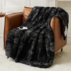 a chair with a blanket on top of it