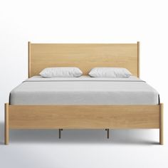 an image of a bed with wooden headboard and foot board on white wall background