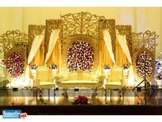 an elaborate stage set up for a wedding ceremony