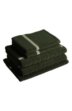 four towels stacked on top of each other in different sizes and colors, all folded up