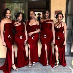 the bridesmaids are all wearing red dresses and one is posing for a photo