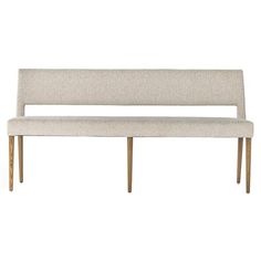 an upholstered bench with wooden legs and a white fabric seat cushion on the back