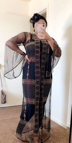 Elegant Abaya. Elegant Long Thobe For Fall, Chic Long Abaya For Eid, Fall Party Abaya With Long Sleeves, Chic Party Abaya In Maxi Length, Chic Party Maxi Length Abaya, Chic Party Maxi Abaya, Festive Evening Thobe With Long Sleeves, Black Abaya With Dabka For Party, Party Black Abaya With Dabka Detail