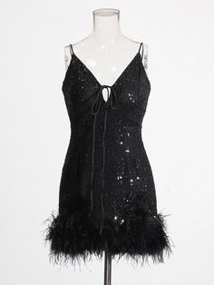 Be the life of the party in this sequin and feather-trimmed mini dress, featuring convertible straps and a fun, flirty silhouette. Everyone will be clucking over your fabulous look! Elasticity: Slight Stretch Decoration: Feathers Material: Polyester Black Sequin Dress With Spaghetti Straps For Cocktail, Glamorous Feather Trim Flapper Dress For Party Season, Black Sequin Cocktail Dress With Spaghetti Straps, Glamorous Flapper Dress With Feather Trim For Party Season, Feathered Flapper Dress For Party, Party Flapper Dress With Feather Trim, Flapper Dress With Feather Trim For Party Season, Black Sequin Dress With Spaghetti Straps For Party Season, Party Season Flapper Dress With Feather Trim