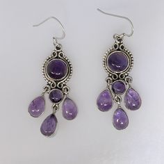 This Is A Lovely Pair Of Amethyst Earrings. Chandelier Style, They Dangle 2.25" With Bale. As Shown In Photos, Amethysts Are A Pleasant Medium Purple Color, Slightly Included But Not Opaque. Cabochons Measure Approximately 6-9mm (Rounds) And 9x7mm Pears. The Earrings Weigh 12.124 Grams. New, No Tags. All Stamped "925". Ess-359 Silver And Purple Earrings, Amethyst Earrings Aesthetic, Handmade Purple Sterling Silver Chandelier Earrings, Amethyst Dangle Earrings Stamped 925, Silver Amethyst Drop Jewelry, Silver Drop Amethyst Jewelry, Sterling Silver Teardrop Chandelier Earrings With Gemstones, Silver Gemstone Chandelier Drop Earrings, Silver Gemstone Drop Chandelier Earrings