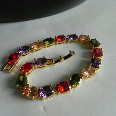 Yellow Gold Plated, Multiple Rhinestones : Garnet - Amethyst - Citrine - Peridot, Oval Stone Shape, Length : 17cm / 6,69291 Inches, Ladder Clasp Type. 15 % Off On Bundles Of 2 Or + Items. Any Other Questions Contact Me Before Purchasing. Elegant Multicolor Crystal Bracelet With Sparkling Stones, Elegant Multicolor Crystal Bracelet, Elegant Multicolor Crystal Bracelet With Rhinestones, Elegant Multicolor Crystal Bracelet With Jewels, Elegant Multicolor Crystal Rhinestone Bracelet, Elegant Multicolor Crystal Bracelet For Formal Occasions, Elegant Multicolor Crystal Bracelet For Formal Events, Multicolor Crystal Bracelet With Sparkling Stones, Multicolor Jeweled Crystal Bracelet For Parties