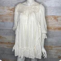 Free People Mini Crotchet Bohemian Dress Size Medium Cream Brand New Without Tags. Never Worn. Excellent Condition, No Flaws A Perfectly Boho Look Starts With The Free People Priscilla White Crochet Mini Dress! This Ultra-Breezy Sundress Begins With Ruffled Straps, A Beautiful Detailed Crochet Neckline, And A Relaxed Bodice, Decorated With Crochet Lace And Pierced Eyelet Embroidery. Trapeze-Style Waist Drops Into A Warm Weather Friendly Mini Hem. Fully Lined. Shell: 100% Rayon. Lining: 100% Visc Bohemian Beach Dress With Lace Patchwork, Beige Bohemian Mini Dress For Brunch, Bohemian Beige Mini Dress For Brunch, Casual Flowy Dresses With Crochet Trim, Bohemian Lace Crochet Dress For Spring, Bohemian Dress With Lace Short Sleeves, Spring Bohemian Crochet Dress With Lace Patchwork, Flowy Cotton Mini Dress With Lace Trim, Summer Crochet Trim Long Sleeve Dresses