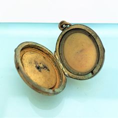 "This is a beautiful gold filled Victorian era locket. The piece is made of gold filled metal set with tiny seed pearls. The interior only has the glass and frame on one side. The locket is in vintage condition with wear consistent with age. Please view all of the pictures for a full view of the piece. The locket measures 1.5\" long and .95\" wide. If you have any questions or would like to see additional pictures, please contact us before making your purchase. Buyers outside the United States, Antique Brass Cameo Locket Necklace, Antique Cameo Medallion Locket Necklace, Antique Gold Cameo Locket Necklace, Victorian Gold Cameo Locket Necklace, Antique Gold Locket Necklace With Cameo, Vintage Yellow Gold Locket Necklace For Memorial, Antique Gold Oval Pendant Locket Necklace, Vintage Yellow Gold Memorial Locket Necklace, Antique Locket Necklace With Vintage Charm