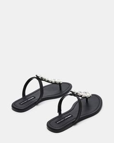 Elevate your look with the GEMMA thong sandal. Its effortless slide on style is perfect for any occasion. The rhinestone detailing on the middle strap adds a touch of glamour and luxury. Jessica Rich | Steve Madden .5 inch heel height Leather upper material with rhinestones Synthetic lining Synthetic sock Synthetic sole Imported Embellished Synthetic Toe Post Sandals, Elegant Synthetic Toe Post Sandals, Elegant Toe Post Synthetic Sandals, Elegant Embellished Toe Post Sandals, Elegant Evening Open Toe Flip Flops, Elegant Evening Flip Flops, 5 Inch Heels, Slide On, Elevate Your Look