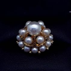 Vintage Mikimoto 14k Gold Pearl Cluster Cocktail Ring Beautiful detailed Cocktail Cluster Ring, set with 19 Mikimoto Pearls, each measuring approx. 3.4-7mm. Table Dimension is approximately 19mm x 19mm Hand crafted in 14 Karat Yellow Gold. The ring epitomizes vintage charm, taking you from day to evening effortlessly. Comes with lacquered wood box Ring Condition is excellent.- Very clean surface, no marks or scratches visible Pearl Condition is excellent - Round with an excellent luster. No mark Classic White Cluster Ring Hallmarked, White Cluster Ring Stamped 14k, Classic White Hallmarked Cluster Ring, High Quality 14k Gold Rings For Anniversary, 14k Gold Rings With Aaa Quality For Anniversary, Aaa Quality 14k Gold Rings For Anniversary, Vintage Gold Jewelry Aaa Quality, White 14k Stamped Cluster Ring, Fine Jewelry Yellow Gold Cluster Jewelry