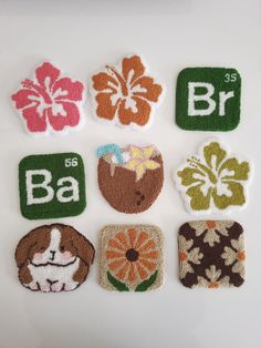 embroidered patches with flowers and the letters b, c, d, e, f