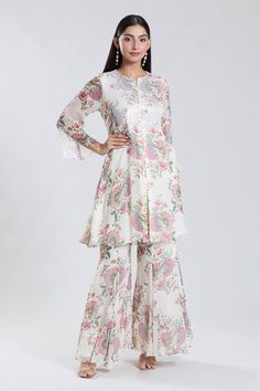 Off white bell sleeves kurta with all over bloomy print and sequin work on the yoke. Paired with a sharara. - Aza Fashions Festive Straight Kurta Set With Floral Print, Anarkali Palazzo Set With Straight Kurta And Floral Print, Floral Print Palazzo Set For Eid Festivities, Floral Print Palazzo Set For Eid, Floral Print Palazzo Set For Eid Festival, Eid Floral Print Palazzo Set With Straight Kurta, Festive Semi-stitched Floral Print Palazzo Set, Designer Cotton Sharara With Floral Print, Festive Sharara With Floral Print And Straight Kurta