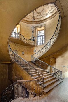 a spiral staircase in an old building