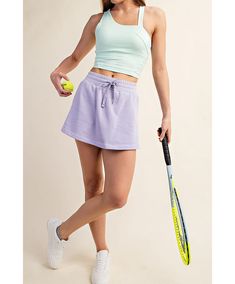 This chic french terry causal skort is an effortlessly stylish piece that prioritizes both comfort and versatility. It features an adjustable drawstring for a customized fit, complemented by an elastic waistband ensuring ease of movement. The skort is thoughtfully designed with practical side pockets and stylish side slits, adding functionality and flair. Whether you're headed to a casual outing, planning a picnic, lounging at home, or engaging in a leisurely game of tennis, this skort is the pe Spring Cotton Athleisure Tennis Skirt, Spring Athleisure Cotton Tennis Skirt, Cotton Athleisure Tennis Skirt For Spring, Athleisure Cotton Tennis Skirt For Spring, Spring Cotton Sports Skort, Casual Cotton Tennis Skirt With Elastic Waistband, Sporty Cotton Tennis Skirt With Elastic Waistband, Summer Cotton Athleisure Tennis Skirt, Spring Loungewear Skort With Elastic Waistband