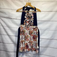 a dress hanging up on a hanger