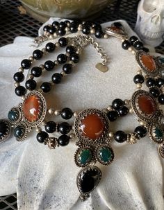 Stunning Bold Beautiful Sterling Silver Carnelian Green and Black Onyx Vintage Bib Festoon Necklace This necklace is absolutley stunning , Not for the faint at heart Measures aprox 16 inches around , necklace has a 2 inches chain extension Each pendant measures over 3 inches See matching earrings in link below https://www.etsy.com/listing/744424320/f?ref=shop_home_active_1&frs=1 Artisan Black Onyx Necklace, Artisan Black Cabochon Jewelry, Handmade Black Bohemian Beads, Gems And Cabochons, Vintage Black Jewelry With Natural Stones, Unique Onyx Gemstone Necklace, Unique Black Gemstone Necklaces, Black Carnelian Jewelry With Natural Stones, Unique Black Gemstone Necklace, Traditional Black Necklaces With Natural Stones