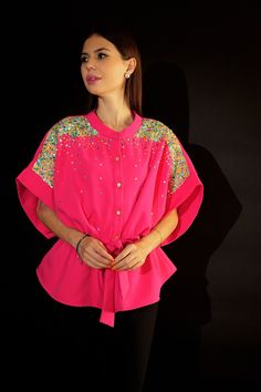 ▶ ABOUT THE TOP: This pink top is a statement of style. Hand embroidered with sequin and tie ups detail. Perfect for a day out at the office or a casual brunch with your friends. Made from banana crepe, the top has a oversized fit and we offer it in plus sizes up to 5XL. ▶ ITEM DETAILS: * Top made with banana crepe * The model is 5'7 tall and wearing size M. * Handmade item, crafted to perfection. * The length of the top is 25 inches ▶ FABRIC: * Made from banana crepe * We offer a variety of fab Festive Pink Tops With Mirror Work, Festive Pink Top With Mirror Work, Embellished Tops For Summer Festivals, Embellished Tops For Summer Festivities, Embellished Summer Tops For Festive Occasions, Summer Festive Embellished Tops, Spring Embellished Embroidered Party Top, Spring Party Embellished Embroidered Top, Festive Embellished Pink Tops