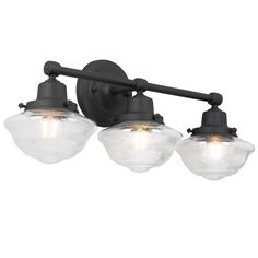 three light bathroom fixture with glass globes on an old - fashioned black metal finish