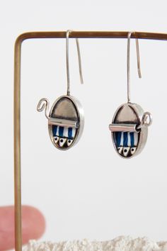 Long earrings in oxidized silver, original and elegant earrings. The silver sardines are enamelled in blue and white. The "can" shaped earrings are also oxidized for a more real and vintage look.  Name of the earrings "sardine cans"  This design belongs to the collection "JEWELRY IN PRESERVES"  The dimensions of the can: 19 x 11 x 5mm and the complete length of the earrings is 37mm Amazing gift Some fun earrings that can be worn every day for a casual look. NOTE ● Please indicate your phone numb Sardine Can, Long Silver Earrings, Oxidized Silver, Fun Earrings, Look Plus, Elegant Earrings, Delivery Service, Earrings Silver, Long Earrings