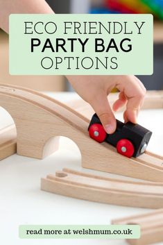 a child playing with a wooden train set and text overlay reads eco friendly party bag options