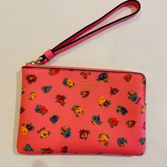 Coach Corner Zip Wristlet/ Mini Vintage Rose Print/Pink/Multi Leather New With Tags Printed Coated Canvas And Smooth Leather Two Credit Card Slots Zip-Top Closure, Fabric Lining Wrist Strap Attached 6 1/4" (L) X 4" (H) X 1/2" (W) Style No. Ca716 Gold Foil Logo Gold-Tone Hardware Wrist Strap: 7" In Length Msrp $78.00 Imported Trendy Pink Rectangular Wristlet, Pink Spring Wristlet, Pink Wristlet For Everyday Use In Spring, Trendy Pink Wristlet For Spring, Pink Wristlet For Daily Use, Pink Pouch Wristlet For Spring, Spring Pink Pouch Wristlet, Pink Wristlet With Wrist Strap For Daily Use, Trendy Pink Wristlet With Wrist Strap